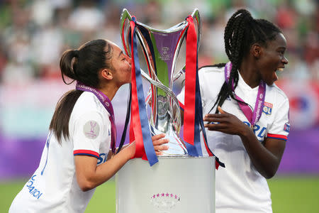 Soccer Football - Women's Champions League Final - Ferencvaros Stadium, Budapest, Hungary - May 18, 2019 Olympique Lyonnais' Selma Bacha and Griedge Mbock celebrate winning the Women's Champions League with the trophy REUTERS/Lisi Niesner