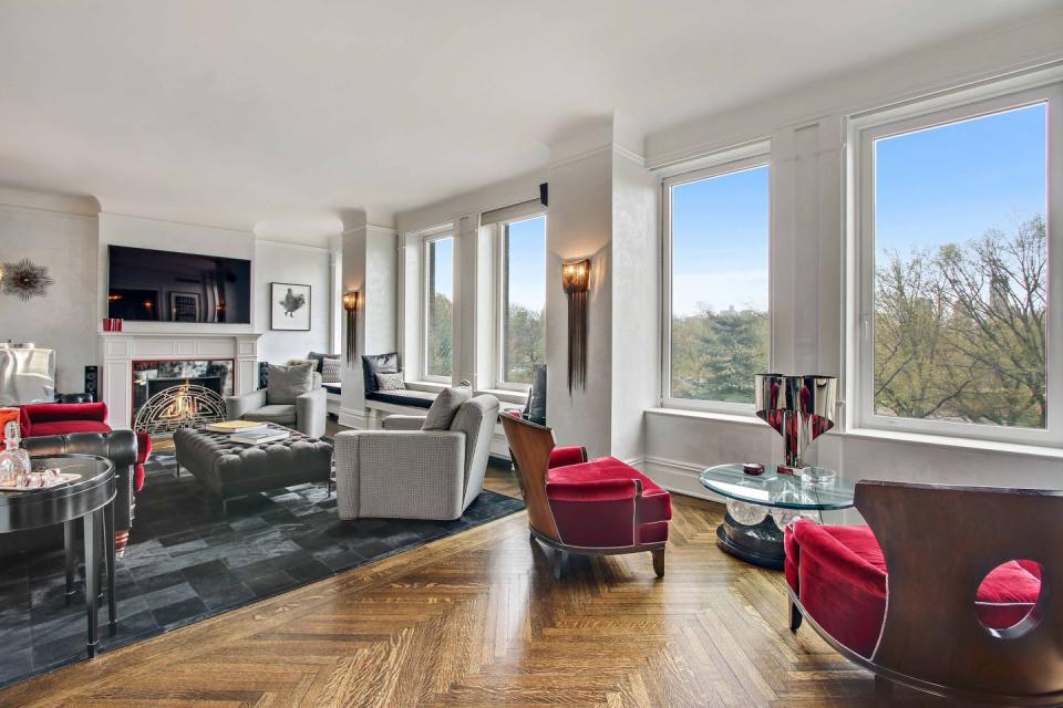 Next to the dining room, the living room features 50 feet of large windows facing Central Park.