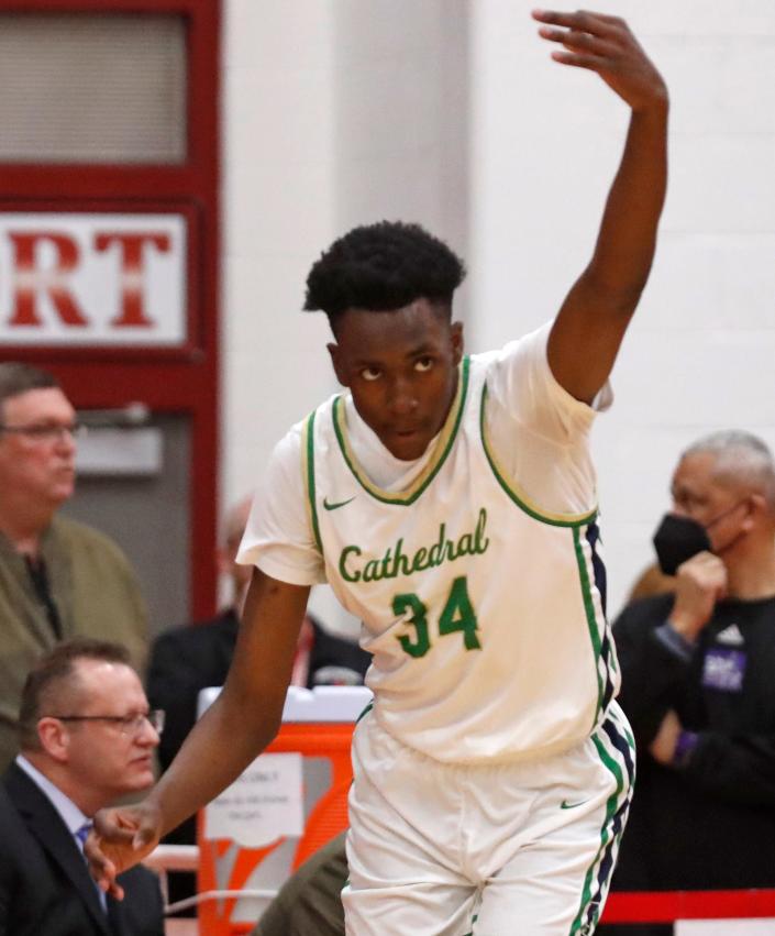 Cathedral Fighting Irish Xavier Booker (34) celebrates after making a shot during the IHSAA regionals boys basketball tournament game against the Ben Davis Giants, Saturday, March 12, 2022, at Southport Fieldhouse in Indianapolis. 