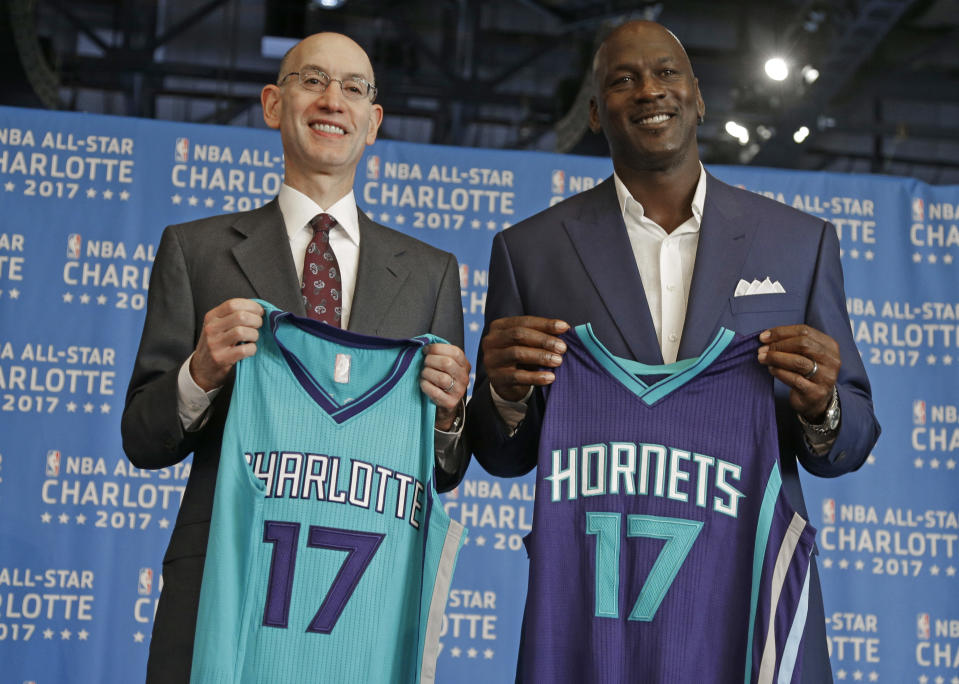 FILE - NBA commissioner Adam Silver, left, and Charlotte Hornets owner Michael Jordan pose for a photo during a news conference to announce Charlotte, N.C., as the site of the 2017 NBA All-Star basketball game, June 23, 2015. Michael Jordan is finalizing a deal to sell the majority share of the Charlotte Hornets, a move that will end his 13-year run overseeing the organization, the team announced Friday, June 16, 2023. Jordan is selling to a group led by Gabe Plotkin and Rick Schnall, the Hornets said. (AP Photo/Chuck Burton, File)