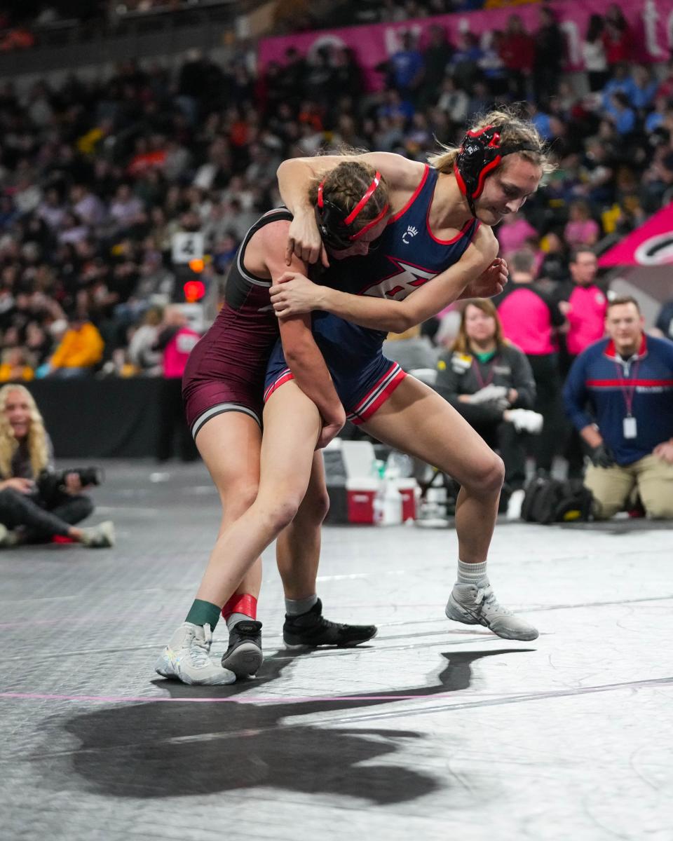 Ankeny’s Trudy Haag wrestles Ballard’s Allison Baker at 120 pounds during the first round of consolation at the Iowa Girl’s state wrestling tournament.