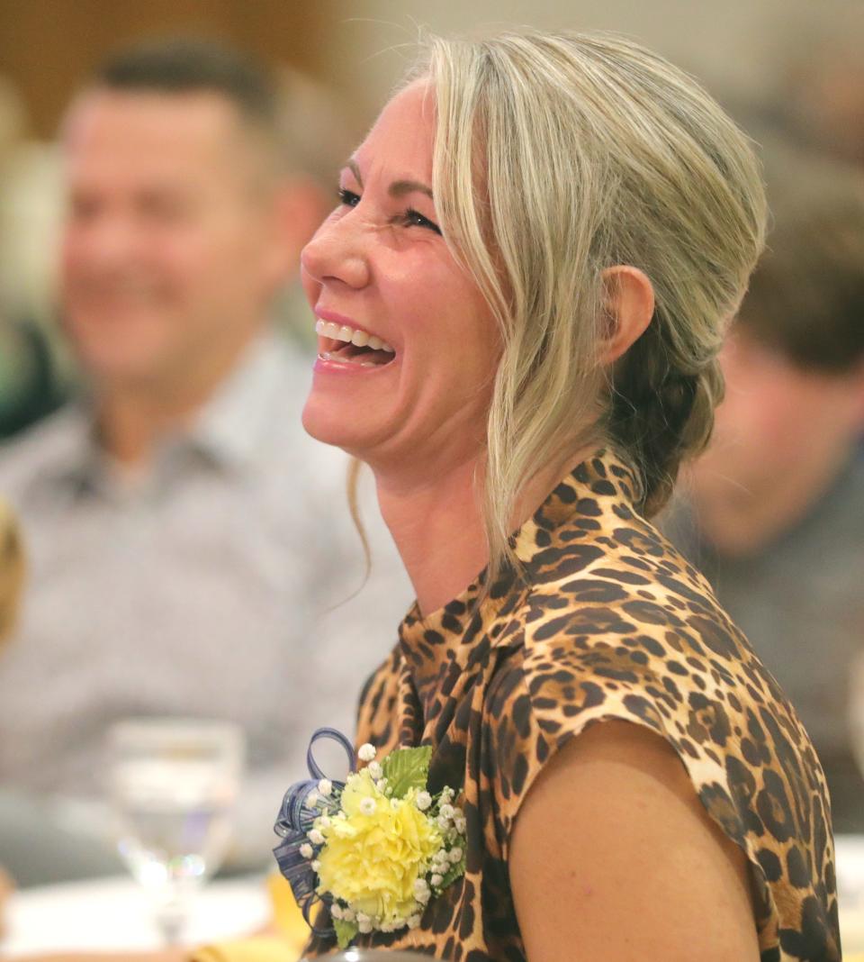 Summit County Sports Hall of Fame inductee Jessica Jenson Starcher listens to one of the induction speeches on Tuesday at Annunciation Greek Orthodox Church in Akron.