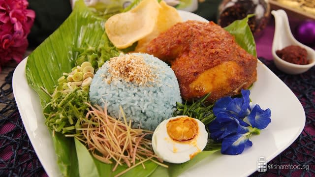 Nasi kerabu with ayam percik malaysian dish