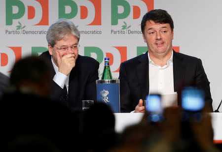 Former Italian Prime Minister Matteo Renzi (R) and Prime Minister Paolo Gentiloni attend a meeting of Democratic Party (PD) in Rome, Italy February 19, 2017. REUTERS/Remo Casilli