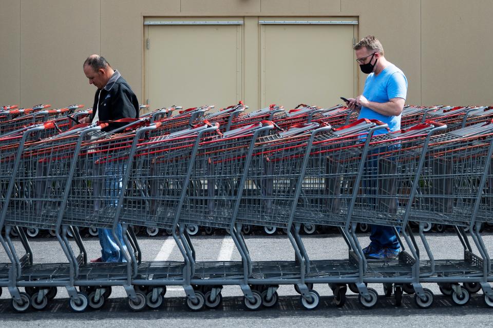 TOPSHOT - Shoppers social distance themselves as they wait in line to get into Costco in Washington, DC, on April 5, 2020. - The number of confirmed coronavirus, COVID-19,  cases in the United States has topped 300,000 and there have been more than 8,100 deaths, Johns Hopkins University reported on Saturday. (Photo by JIM WATSON / AFP) (Photo by JIM WATSON/AFP via Getty Images)