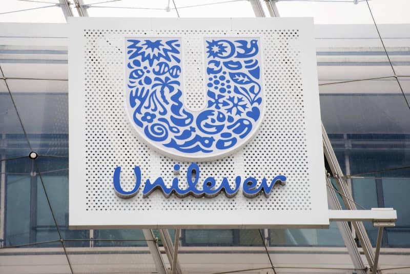The Unilever logo is seen on the facade of the company's Hamburg headquarters. Daniel Reinhardt/dpa