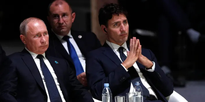 Russian President Vladimir Putin, left, and Canadian Prime Minister Justin Trudeau in Paris in November 2018.