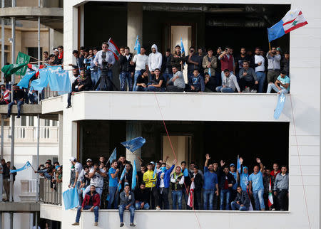 Supporters of Saad al-Hariri who suspended his decision to resign as prime minister are seen near his home in Beirut, Lebanon November 22, 2017. REUTERS/Mohamed Azakir