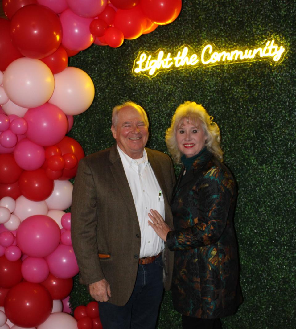 Harrison and Debbie Moody of Dinwiddie strike poses at "Light the Community" fundraising event at White Oak Manor in Dinwiddie on February 17, 2024.