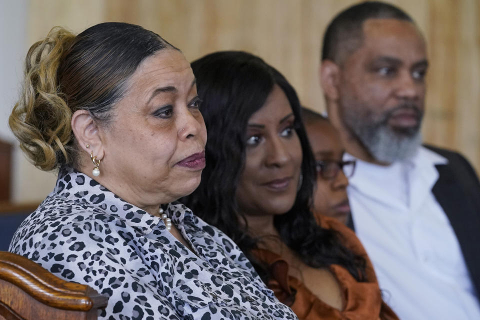 Descendants of Tulsa Race Massacre survivor Ernestine Alpha Gibbs sit together during an interview in Tulsa, Okla., on Sunday, April 11, 2021. From left are her daughter, Carolyn Roberts; granddaughter-in-law, Tracy Gibbs; great-grandson, LeRoy Gibbs III, and grandson LeRoy Gibbs II. LeRoy II credits his grandmother, who not only built wealth and passed it on, but also showed succeeding generations how it was done. It was a lesson that few descendants of the victims of the race massacre had an opportunity to learn. “The perseverance of it is what she tried to pass on to me,” said LeRoy Gibbs II. “We were fortunate that we had Ernestine and LeRoy … They built their business.” (AP Photo/Sue Ogrocki)