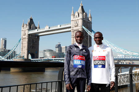 Athletics - London Marathon - Elite Men Press Conference - London, Britain - April 19, 2018 Kenya's Daniel Wanjiru and Eliud Kipchoge pose for a photograph Action Images via Reuters/Peter Cziborra