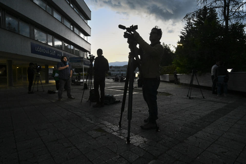 Television crews report from the F. D. Roosevelt University Hospital, where Slovak Prime Minister Robert Fico, who was shot and injured, is treated in Banska Bystrica, central Slovakia, Wednesday, May 15, 2024. Slovak Prime Minister Robert Fico is in life-threatening condition after being wounded in a shooting after a political event Wednesday afternoon, according to his Facebook profile.(AP Photo/Denes Erdos)