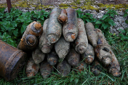 Unexploded shells recovered in the Meuse River are seen on the bank at Sivry-sur-Meuse, close to WWI battlefields, near Verdun, France, October 24, 2018 before the centenial commemoration of the First World War Armistice Day. REUTERS/Pascal Rossignol