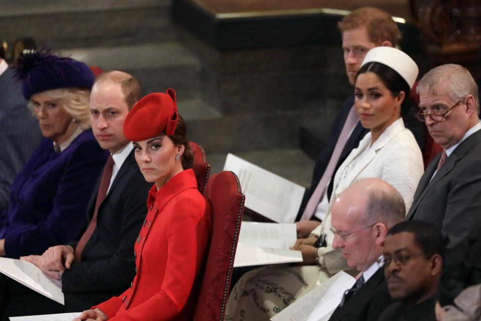 Catherine, Duchess of Cambridge, (foreground centre), sits with Prince William, Camilla, the Duchess of Cornwall and Prince Charles, front row, Prince Andrew, background right, Meghan, the Duchess of Sussex and Prince Harry, at the Commonwealth Service at Westminster Abbey