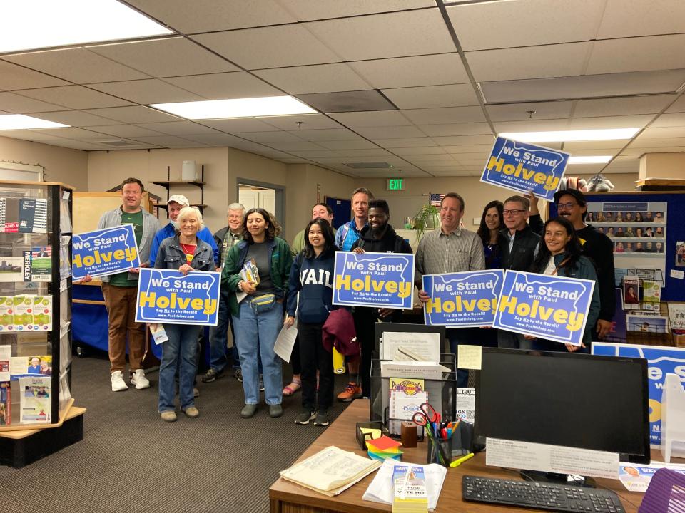 Rep. Paul Holvey (fifth from the right) and supporters prepare to go door-knocking Saturday to persuade people to vote against the Oct. 3 recall election.