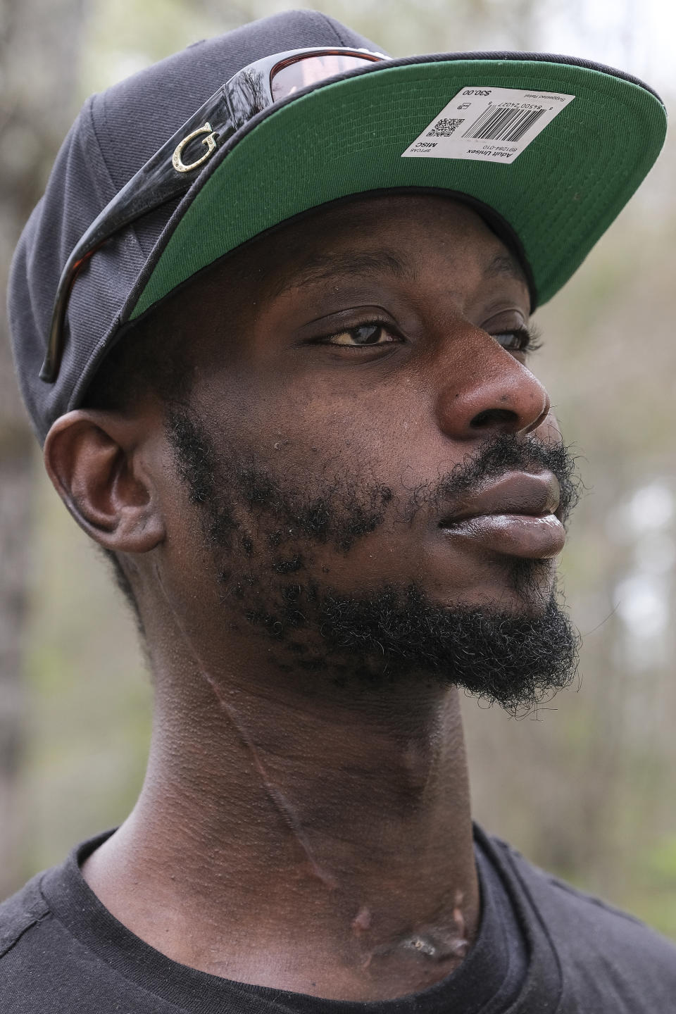 Michael Corey Jenkins stands outside Taylor Hill Church in Braxton, Miss., March 18, 2023. In a notice of an upcoming lawsuit, attorneys for Jenkins and his friend, Eddie Terrell Parker, said six white deputies burst into the home where Parker was staying on the night of Jan. 24 and proceeded to handcuff and beat them, stun them with Tasers repeatedly over roughly 90 minutes and forced them to lie on their backs as the deputies poured milk over their faces. Jenkins and Parker say it came to a head when a deputy shoved a gun into Jenkins’ mouth and pulled the trigger, leaving him with a mangled tongue and serious ongoing complications, including difficulty speaking and eating. (AP Photo/HG Biggs)