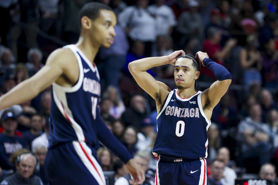 Gonzaga guards Nolan Hickman (11) and Ryan Nembhard (0) react during the second half of the team's NCAA college basketball game against Saint Mary's for the championship of the West Coast Conference men's tournament Tuesday, March 12, 2024, in Las Vegas. (AP Photo/Ian Maule)