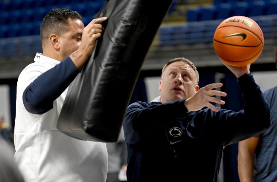 Coach Mike Rhoades demonstrates a drill during Penn State men’s basketball practice on Monday, Oct. 23, 2023.