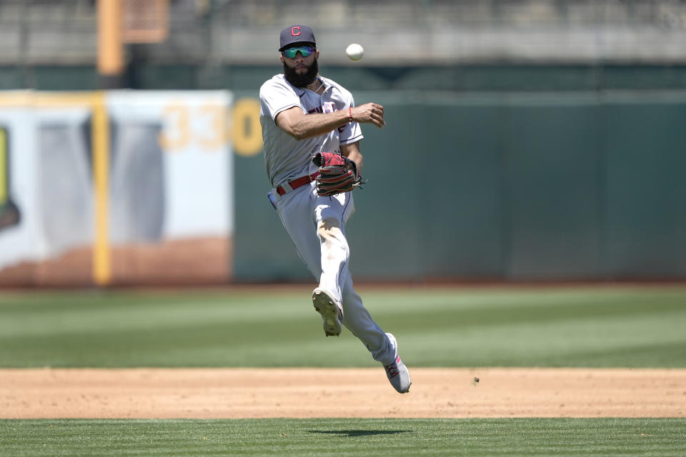 Cleveland Indians shortstop Amed Rosario throws to first base on a ball hit by Oakland Athletics' Aramis Garcia during the second inning of a baseball game Saturday, July 17, 2021, in Oakland, Calif. Aramis Garcia was out at first. (AP Photo/Tony Avelar)