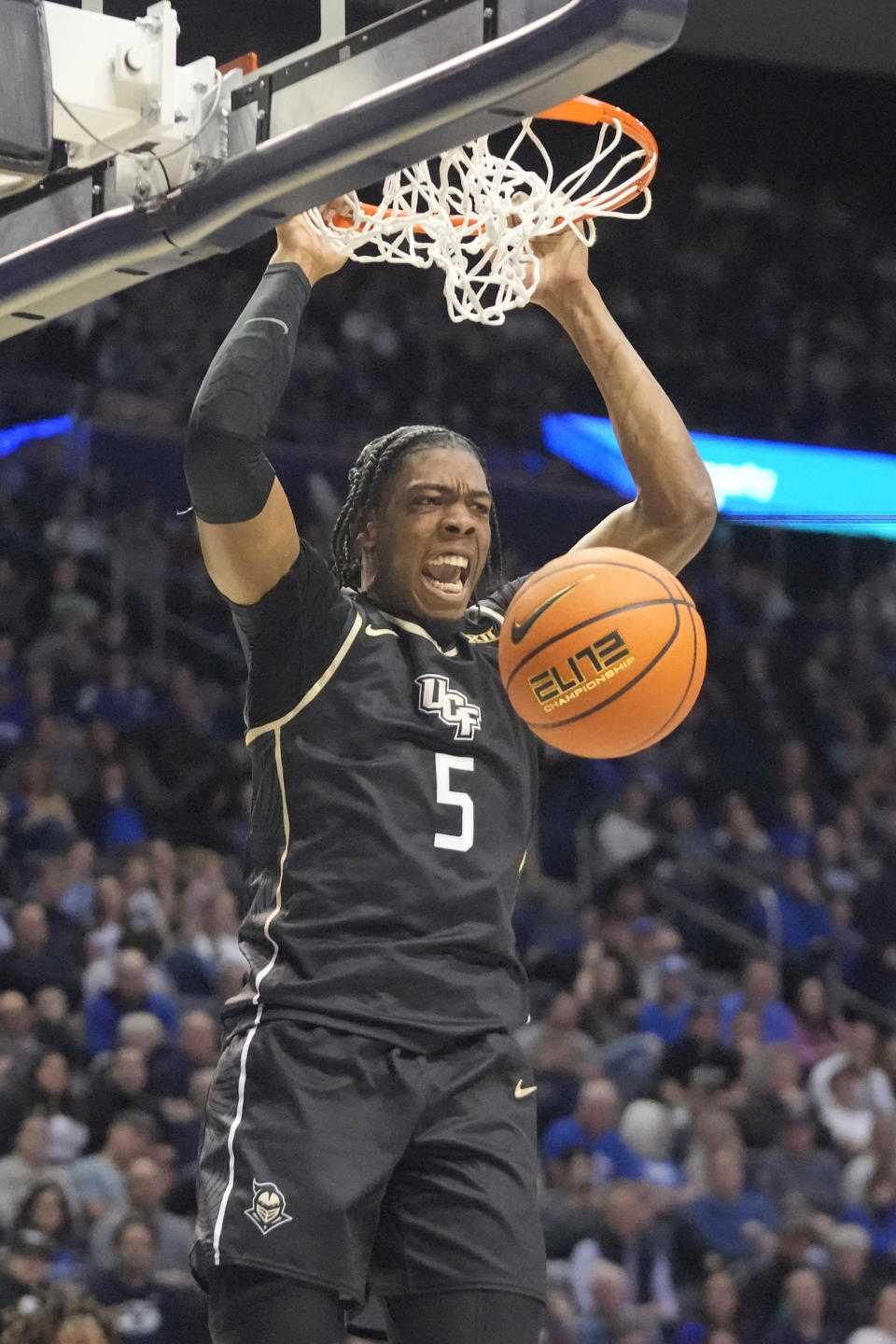 Central Florida forward Omar Payne (5) dunks against BYU during the first half of an NCAA college basketball game Tuesday, Feb. 13, 2024, in Provo, Utah. (AP Photo/Rick Bowmer)