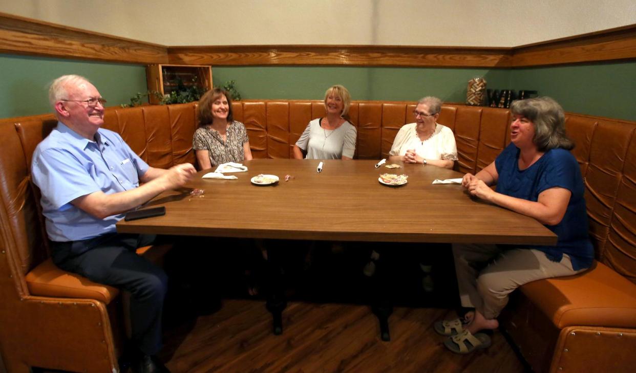 From left, Glenn walker, Rita Scism, Jane Falls, Ruth Williams and Tammy Green enjoy a lunch break from Laura's Homes at Toscanos Bistro in uptown Shelby in 2020.