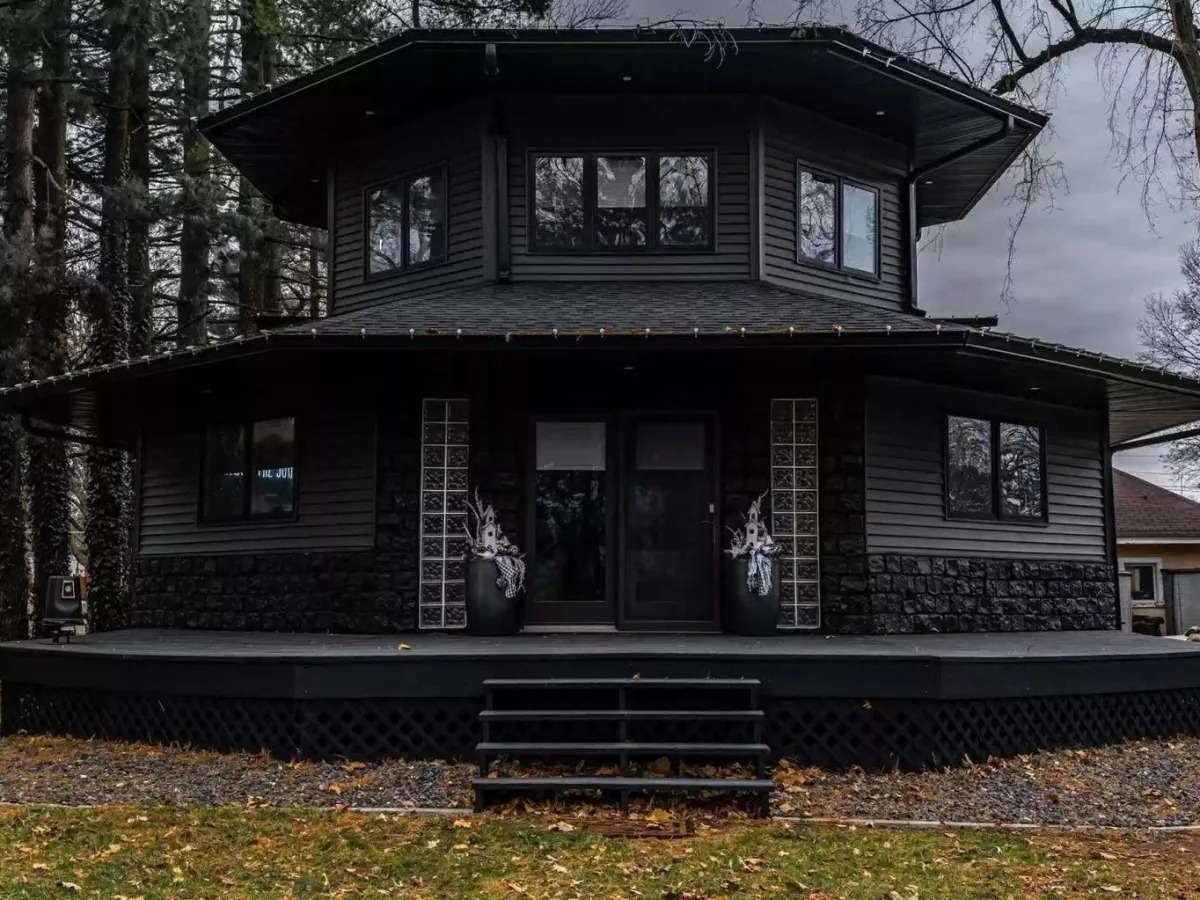 A $250,000 all-black house in Illinois is going viral for its gothic look, but the owner says it was unintentional