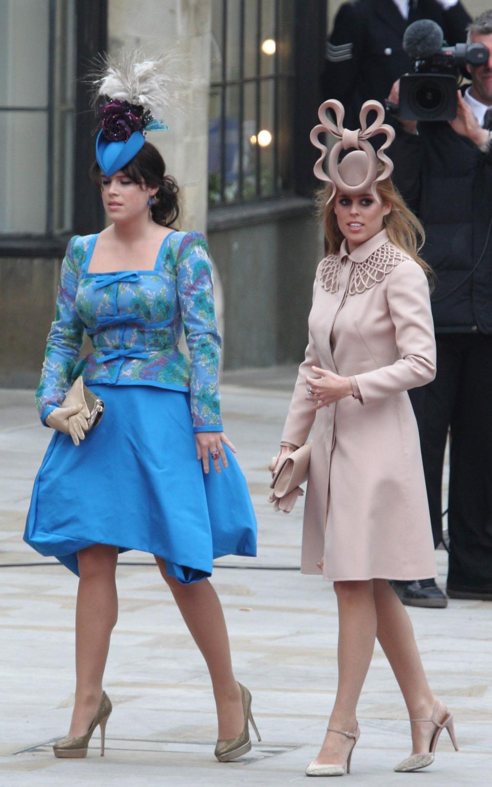 Princesses Beatrice and Eugenie of York attend the royal wedding of Prince William and Catherine Middleton in 2011.  - Wireimage