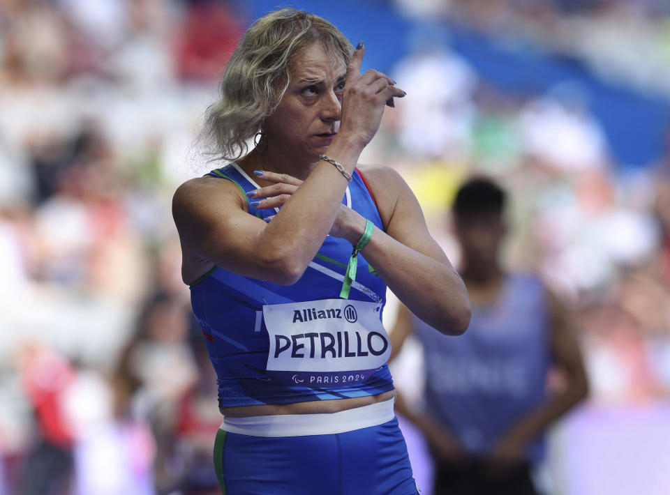 Italy's Valentina Petrillo prepares to compete in the women's 400m T12 round 1, at the Stade de France Stadium, during the 2024 Paralympics, Monday, Sept. 2, 2024, in Paris, France. (AP Photo/Jackson Ranger)