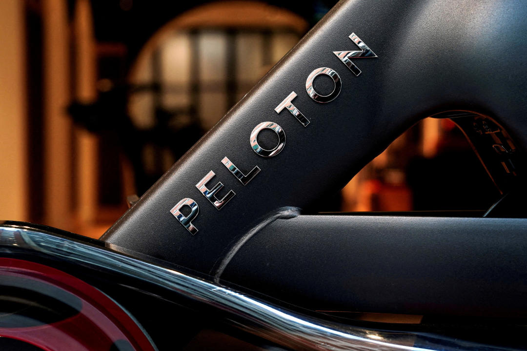 FILE PHOTO: A stationary bicycle inside of a Peloton store is pictured in the Manhattan borough of New York City, U.S., January 25, 2022.  REUTERS/Carlo Allegri/File Photo