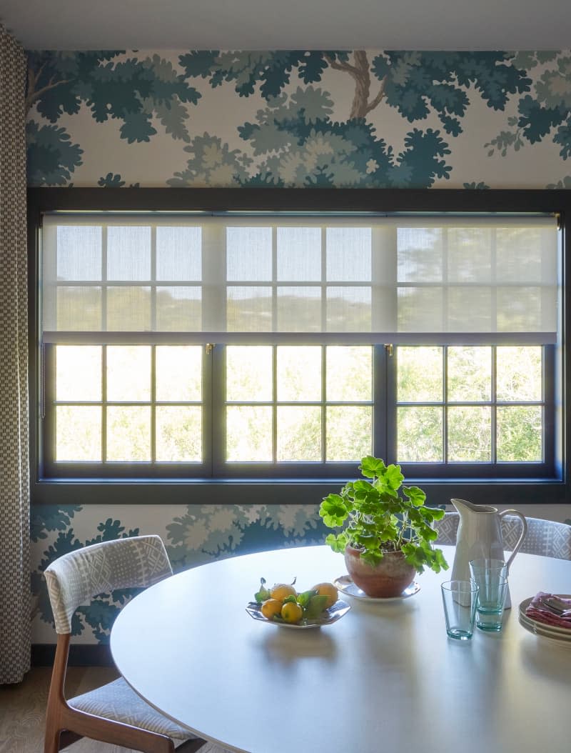 Wallpapered dining room.