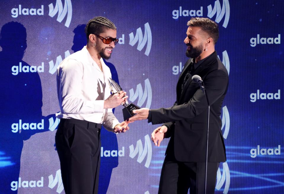 (L-R) Bad Bunny and Ricky Martin speak onstage during the GLAAD Media Awards at The Beverly Hilton on March 30, 2023 in Beverly Hills, California.