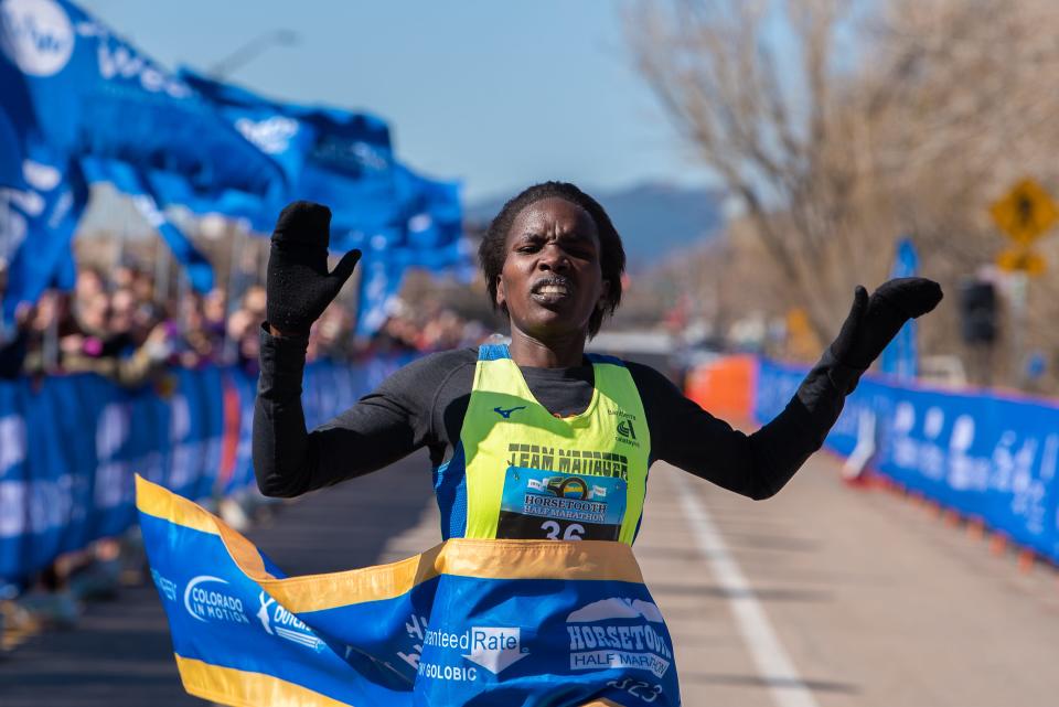 First-place women's finisher Sarah Naibei crosses the finish line of the 50th Horsetooth Half Marathon on April 16, 2023, in Fort Collins.