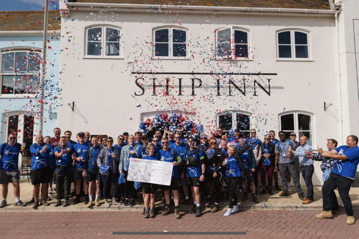 Tesco employees walked 12 miles from Lulworth Coce to the Ship  Inn in Weymouth to raise money for mental health <i>(Image: Supplied)</i>