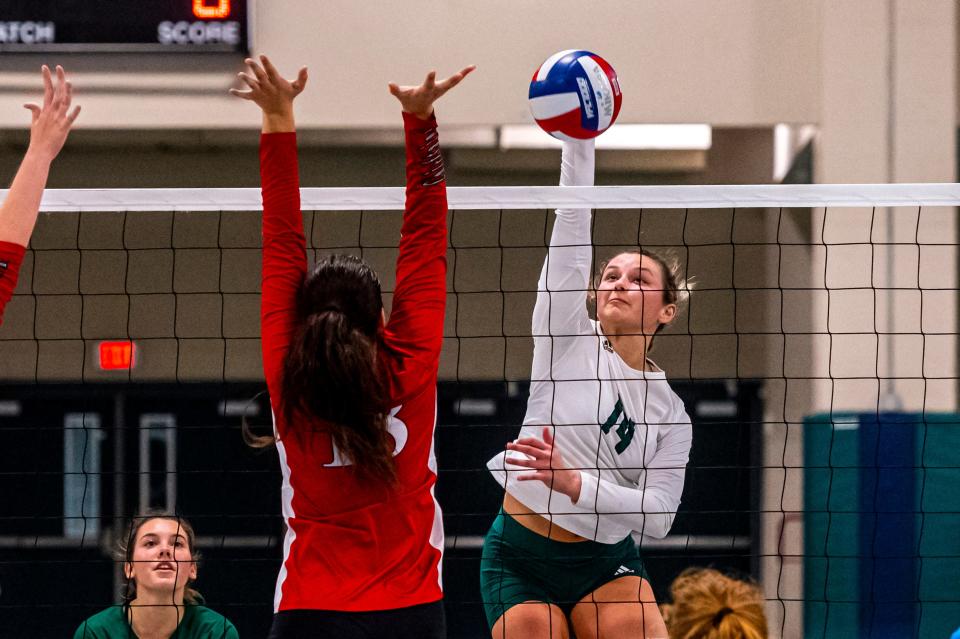 Dartmouth's Ava Crane goes for the spike.