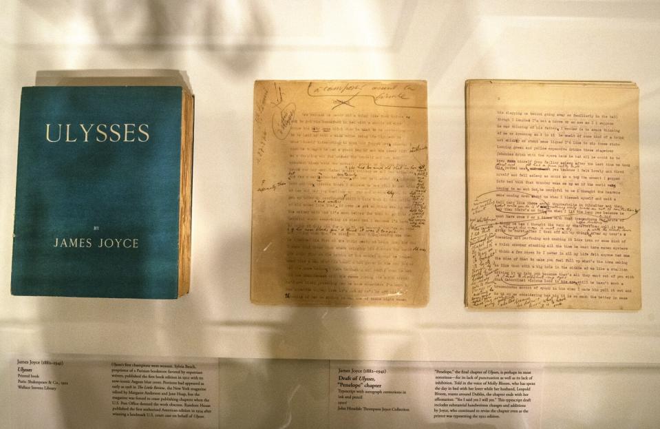 The cover of James Joyce's "Ulysses" at left and two and typescript piles at right with corrections in ink and pencil.