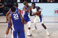 Indiana Pacers guard Victor Oladipo (4) handles the ball against Philadelphia 76ers guard Josh Richardson (0) during the second quarter of an NBA basketball game Saturday, Aug. 1, 2020, in Lake Buena Vista, Fla. (Kim Klement/Pool Photo via AP)