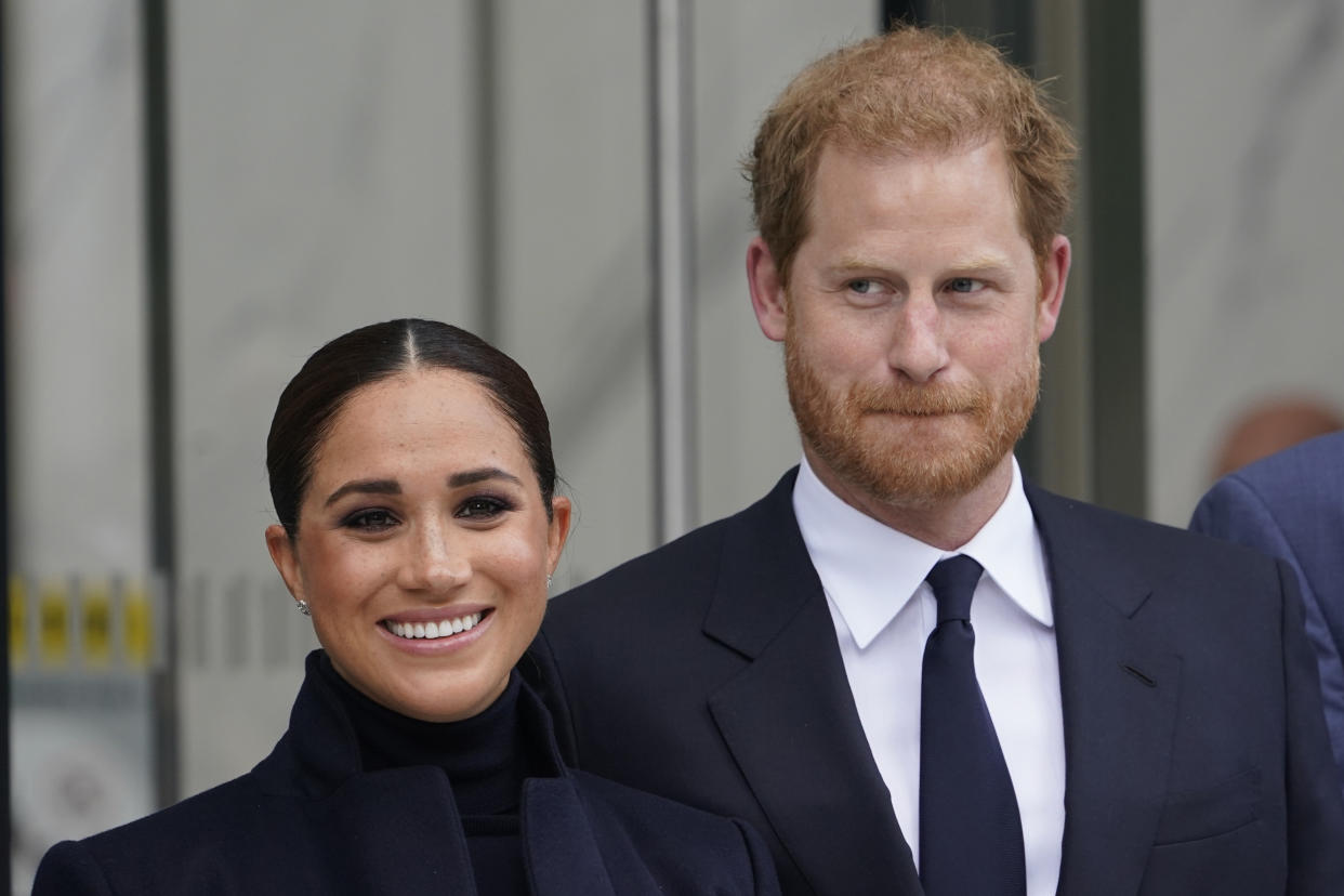 FILE - Meghan Markle and Prince Harry pose for pictures after visiting the observatory in One World Trade in New York, Thursday, Sept. 23, 2021. The Duchess of Sussex on Thursday, Dec. 2, 2021, won the latest stage in her long-running privacy lawsuit against a newspaper publisher over its publication of parts of a letter she wrote to her estranged father. The Court of Appeal in London upheld a High Court ruling in February that publication of the letter that Meghan Markle wrote to her father Thomas Markle after she married Prince Harry in 2018 was unlawful and breached her privacy. (AP Photo/Seth Wenig, File)