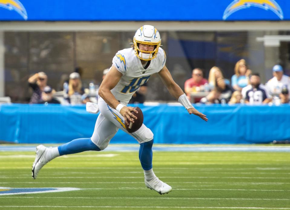 Chargers quarterback Justin Herbert scrambles against the Dallas Cowboys.