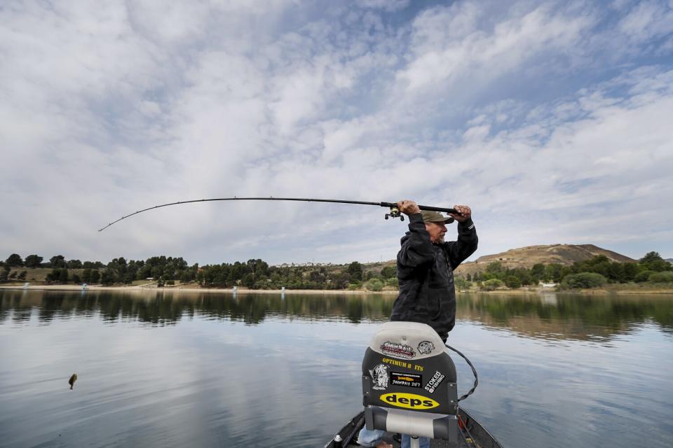 Butch Brown casts while fishing at Castaic Lake.