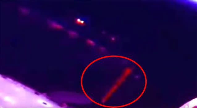 A YouTuber believes the red light seen in this footage could be a beam fired from an alien spacecraft. Source: YouTube