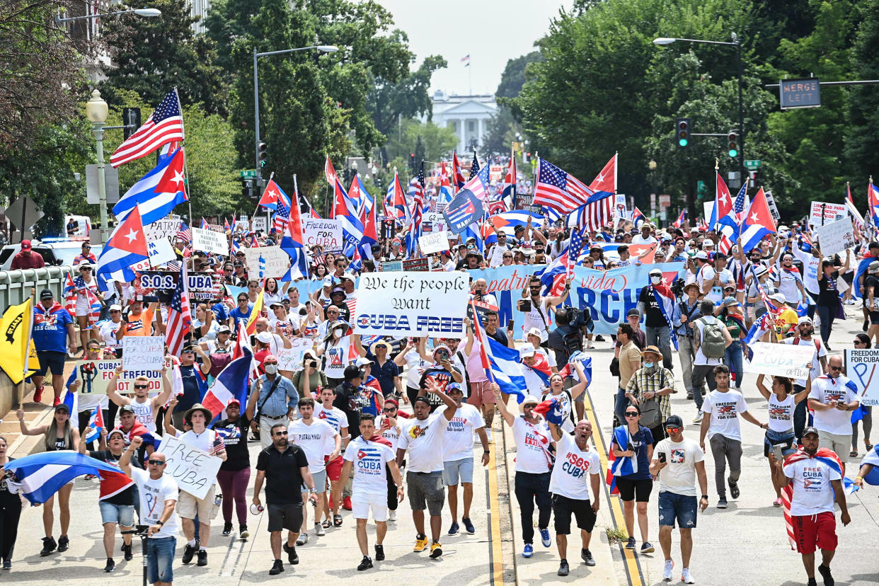 Image: People march during a protest in support of continued anti-government protests in Cuba near the White House on July 26, 2021. (Brendan Smialowski / AFP - Getty Images)