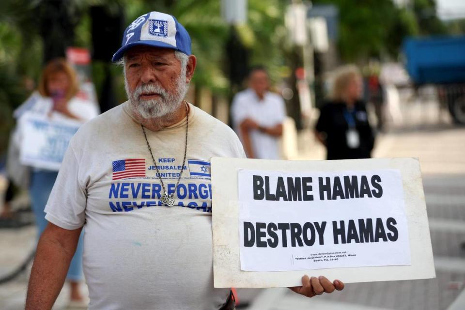 Bob Kunst, 81, of Miami Beach holds a sign as he shows his support for Israel at the Holocaust Memorial on Tuesday, Oct. 10, 2023, in Miami Beach, Fla. MATIAS J. OCNER/mocner@miamiherald.com