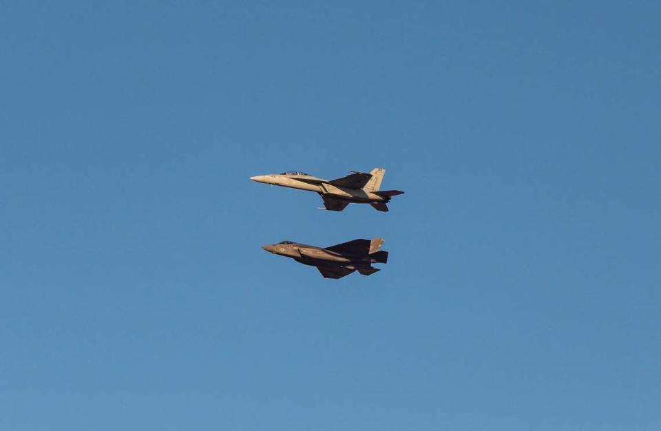 U.S. Navy pilot Lt. Matteo “Hog Sweat” Mezzetti, a Sacramento native, flies his FA-18 E/F Super Hornet, also known as the “Rhino,” above the Navy’s F-35C Lightning II during a first-of-its-kind pairing at the California Capital Airshow on Friday, Sept. 24, 2021, at Mather Airport in Sacramento.