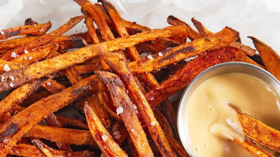 crispy, baked sweet potato fries seasoned with freshly ground black pepper, garlic powder, onion powder, and paprika