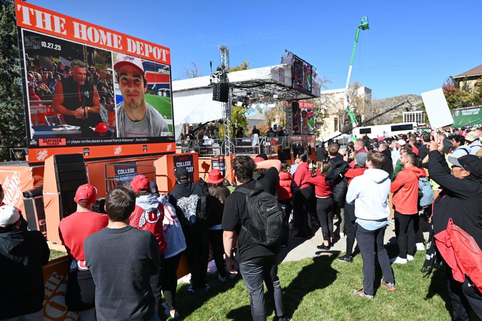 Crowd members watch and cheer as former Utah Ute and current Buffalo Bills player Dalton Kincaid talks with Pat McAfee during his show at the University of Utah in Salt Lake City on Friday, Oct. 27, 2023. | Scott G Winterton, Deseret News
