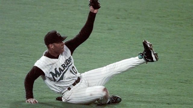 Florida Marlins catcher Ivan Pudge Rodriguez points to the sky, Yankees  Derek Jeter in foreground, after hitting a double against the New York  Yankees in game 4 of the 2003 MLB World