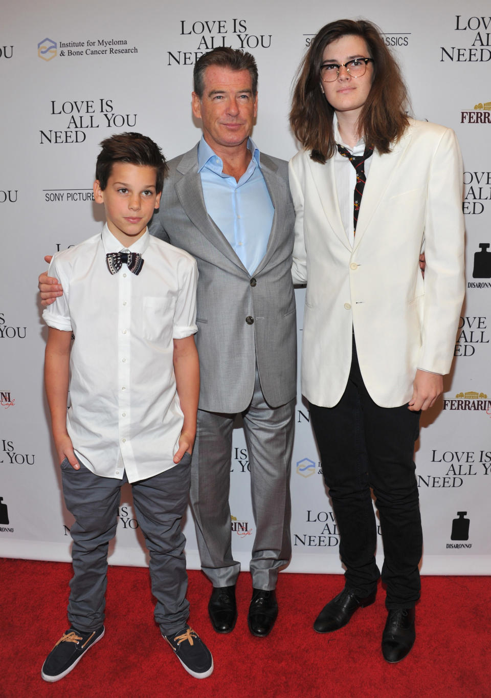 Pierce Brosnan with his sons on the red carpet