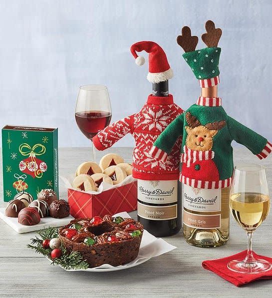 <p><strong>Harry & David</strong></p><p>harryanddavid.com</p><p><strong>$89.99</strong></p><p>Featuring one Harry & David Ross Lane red blend and one white blend, the wine bottles in this whimsical set come dressed up in decorative ugly Christmas sweaters and hats. The gift also comes with a traditional fruitcake, raspberry-filled tree-cutout shortbread cookies, and signature chocolate truffles in a variety of flavors — all of which pair nicely with a glass of the vino.</p>