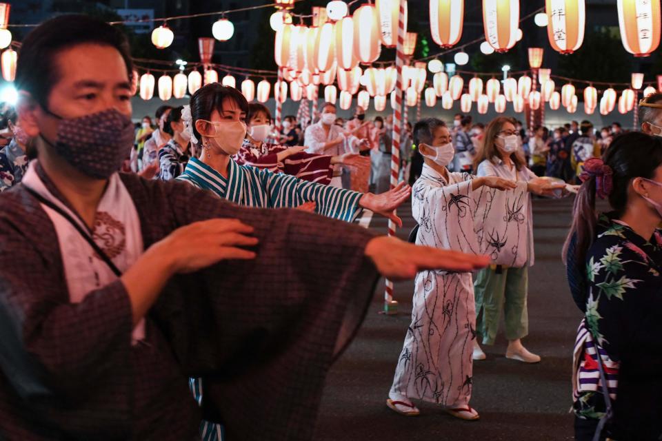 Residents attend the annual Tsukiji Honganji Bon Dance Festival at Tsukiji Honganji Temple in Tokyo on August 5, 2022. - The annual 