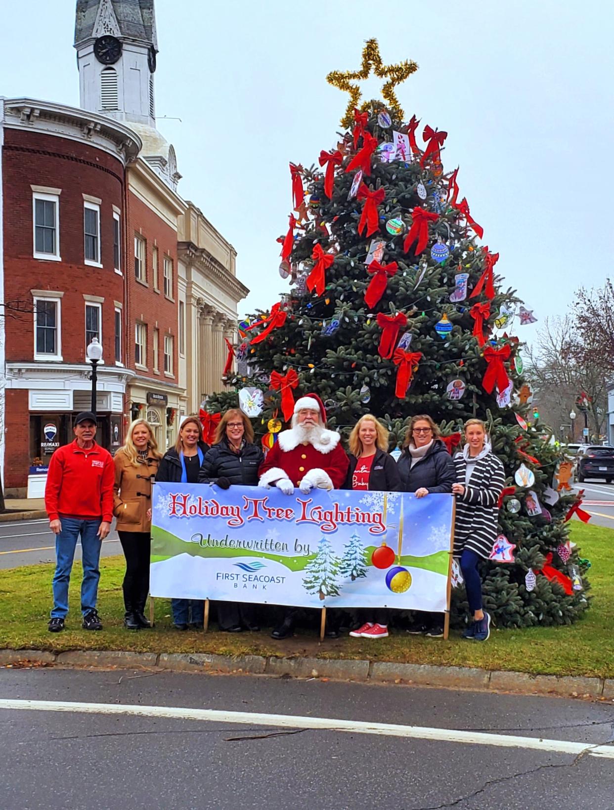 Holiday Events Committee Chair Norman Sanborn; Tatjana Simon, Northeast Credit Union; Candace Rowell, Service Credit Union; Sharla Rollins, First Seacoast Bank; Santa; Carrie Alex, Alex & Associates at Keller Williams; Kelley Patterson, Alex & Associates at Keller Williams; and Holiday Event Committee Member Mandy Barstow.